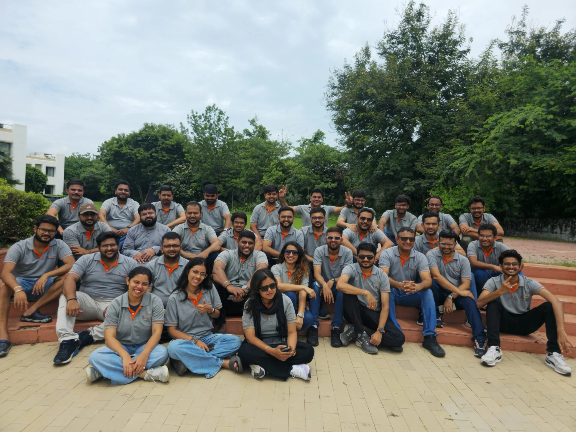 The Orbrick team posing for a group photo outdoors, demonstrating the company's size and team spirit